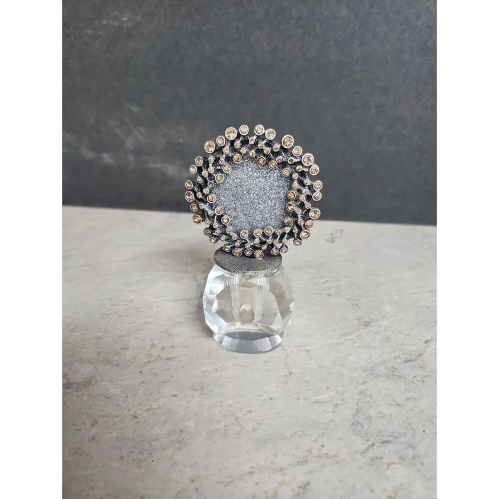 Empty perfume bottle with photo holder